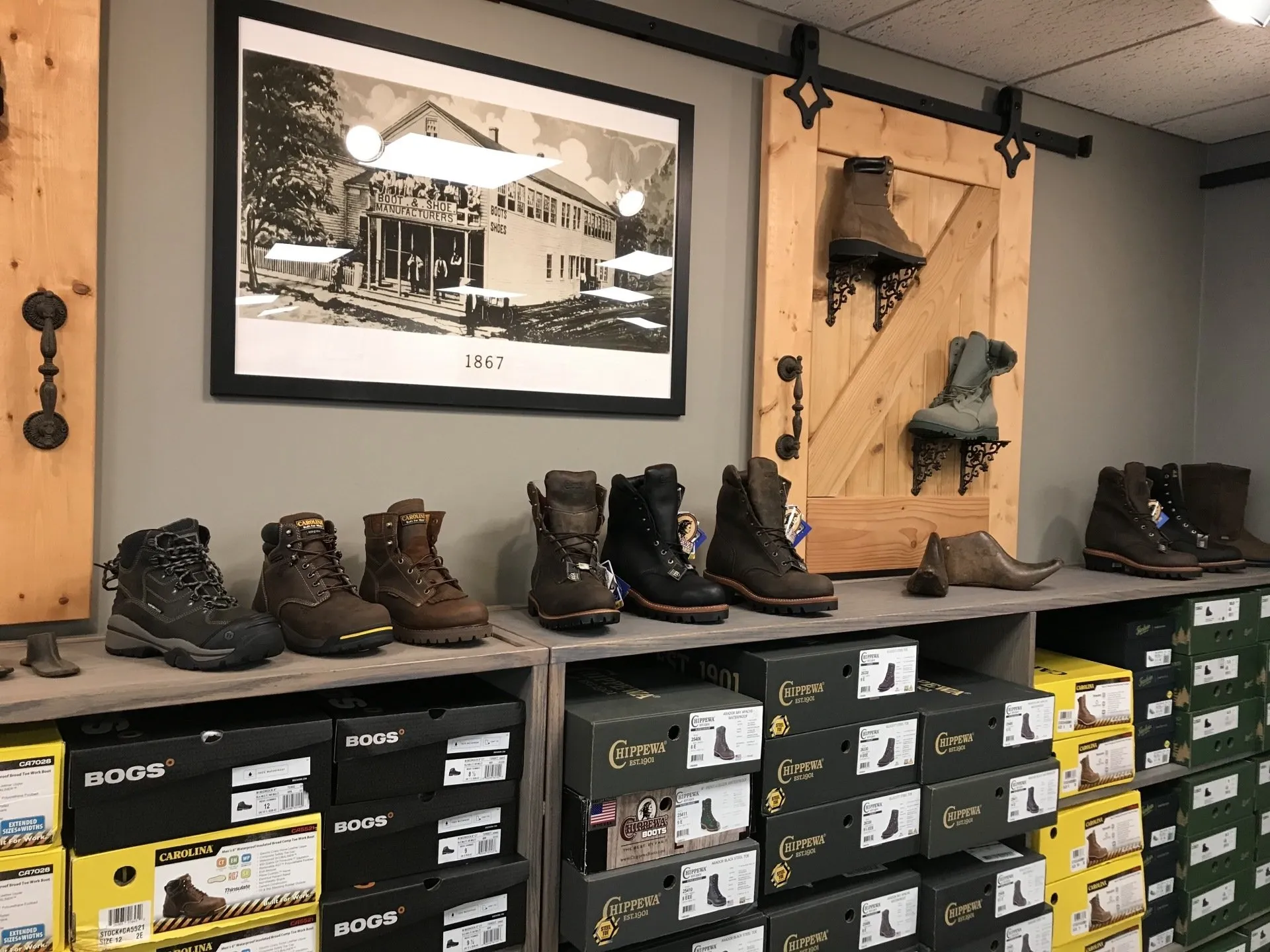 Wall display of rugged work boots